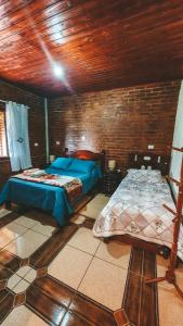 Ένα ή περισσότερα κρεβάτια σε δωμάτιο στο Casa Doce Lar, novidade embaixo da Pedra do Baú +25 φωτογραφίες