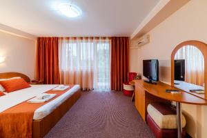 Tempat tidur dalam kamar di Hotel Giulia
