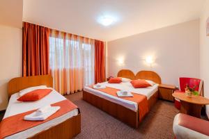 Un pat sau paturi într-o cameră la Hotel Giulia