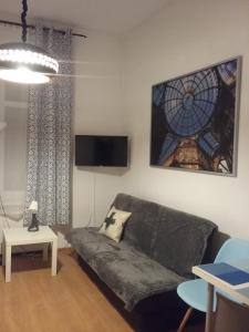 Televízia a/alebo spoločenská miestnosť v ubytovaní Apartament