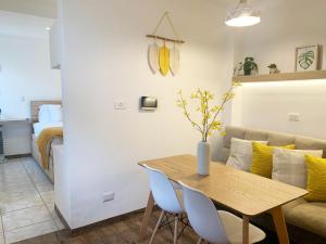 a living room with a table and a couch at Silver Sun Apartment in Guatemala