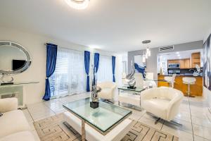 a living room with a glass table and chairs at Luxurious and cozy Townhouse 3 bedrooms 2.5 Bath in Miami