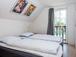 Postel nebo postele na pokoji v ubytování 8 person holiday home in Rømø-By Traum