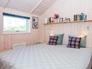 En eller flere senge i et værelse på 6 person holiday home in Hemmet-By Traum