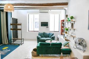 TV a/nebo společenská místnost v ubytování Le Fortia II - Appartement Vieux-Port