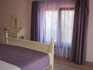 Ένα ή περισσότερα κρεβάτια σε δωμάτιο στο Guest House Villa Elma