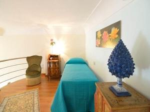 a bedroom with a bed and a christmas tree on a table at Luxury Apartment Federica N 1 Centro Storico di Taormina in Taormina +67 photos