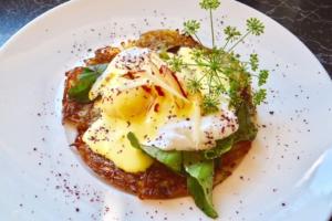 a plate of food with an egg on top at City Escape Taroona in Taroona