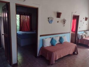 Un pat sau paturi într-o cameră la Villa Silvestre