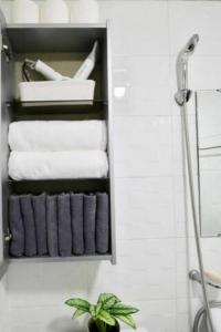 a bathroom with a towel rack with towels at Seoul Central Namsan Studio 2Beds #102 in Seoul