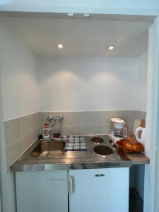 Kuchyňa alebo kuchynka v ubytovaní Anna apartman