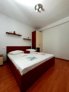 A bed or beds in a room at Apartments Tri sestrice