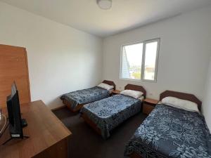 Postel nebo postele na pokoji v ubytování Гостевой дом Акварель 阿克瓦雷爾旅館 Guest house Akvarel 게스트하우스 아크바렐