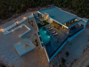 an overhead view of a house with a swimming pool at Villa Porta Novalja in Novalja
