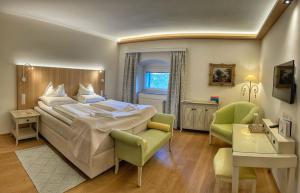 Postel nebo postele na pokoji v ubytování Hotel Schloss Lerchenhof