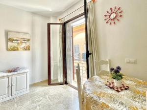 a bedroom with a door open to a balcony at Jazmín Apartamentos Centro in Málaga