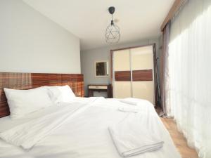 Кровать или кровати в номере Blueway Hotel Residence
