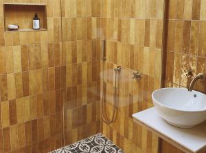 a bathroom with a sink and a shower at Luxury bolthole in central St.Agnes with parking. in St. Agnes