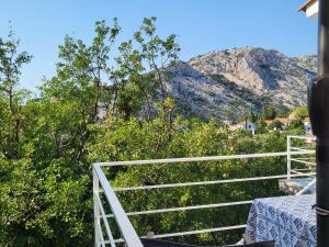 a balcony of a house with a view of a mountain at Apartment Stipe in Donja Klada