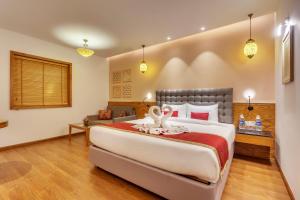 Postel nebo postele na pokoji v ubytování Golden Tulip New Delhi - Hari Nagar