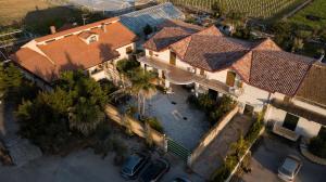 an overhead view of a large house with a parking lot at beucarnea apartment salerno in Eboli