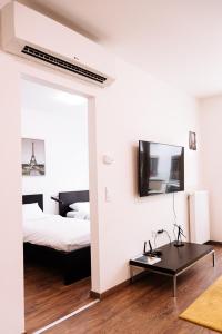 A bed or beds in a room at A 210, apartments in the heart of Budapest