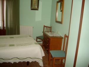 מיטה או מיטות בחדר ב-Las Tercias