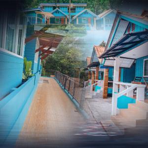 una fila de casas con pintura azul. en Ban Tidlay - SHA en Ko Yao Noi