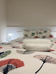 a roll of paper on top of a bed at Vista Petrovac in Petrovac na Moru