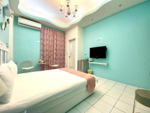 TV a/nebo společenská místnost v ubytování Hualien Dawan B&B