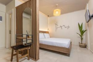 Ένα ή περισσότερα κρεβάτια σε δωμάτιο στο Noemie Premium Holiday Apartments