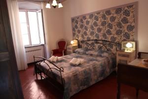 A bed or beds in a room at Le ortensie di Villa Vittoria nel verde a pochi minuti di auto dalle spiagge