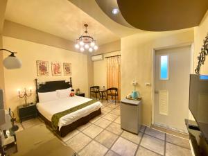 Postel nebo postele na pokoji v ubytování Hualien Dawan B&B