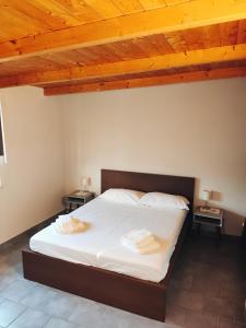 Кровать или кровати в номере Sosta Pompeiana