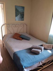 מיטה או מיטות בחדר ב-Maro's Guesthouse