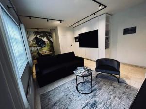 TV a/nebo společenská místnost v ubytování Guesthouse Ter Linden
