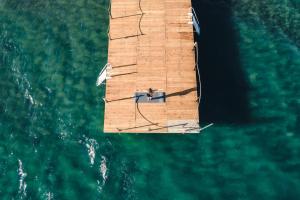 an overhead view of a wooden sail boat in the water at Acroter Hotel Spa - Alcohol Extra All Inclusive in Datca