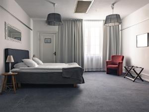 Säng eller sängar i ett rum på Best Western Strand Hotel
