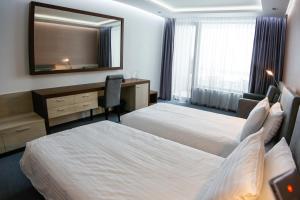 Voodi või voodid majutusasutuse Uva Nestum Wine & SPA toas