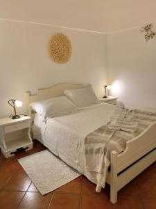 A bed or beds in a room at TENUTA MONTANARO