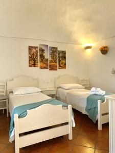 A bed or beds in a room at TENUTA MONTANARO