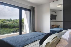 Giường trong phòng chung tại Villa Monte Grosso 2 +17 ảnh