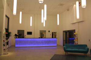 a lobby with a blue counter in a building at Snäck Annex in Visby