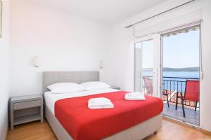 Posteľ alebo postele v izbe v ubytovaní Apartments Mastelic