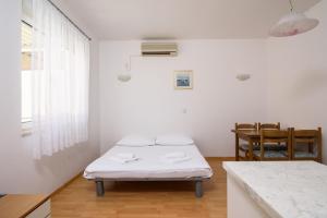 Posteľ alebo postele v izbe v ubytovaní Apartments Mastelic