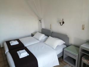 Posteľ alebo postele v izbe v ubytovaní Oasis Apartments