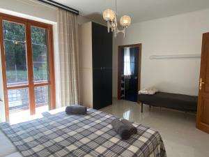 Postel nebo postele na pokoji v ubytování B&B Rox e Claudia
