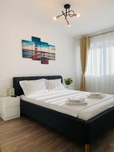 מיטה או מיטות בחדר ב-Newton luxury apartment