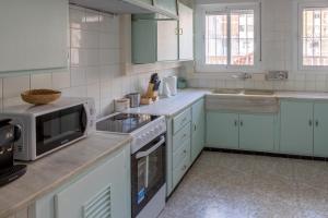 Kuchnia lub aneks kuchenny w obiekcie CHALET VILLA Los HIPOCAMPOS