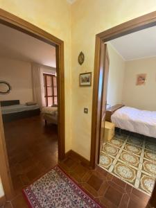 Postel nebo postele na pokoji v ubytování B&B Rox e Claudia